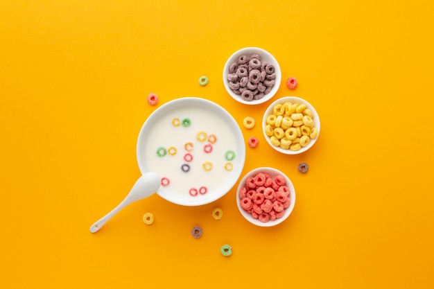 Top view delicious bowls of milk with cereal