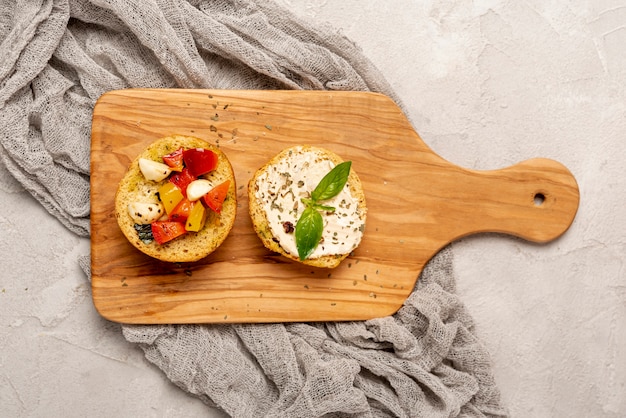 Top view of delicious bread with tomatoes on chopper