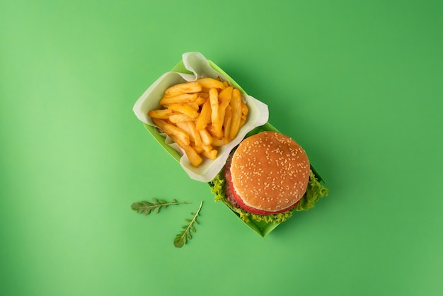 Top view delicious burger and fries