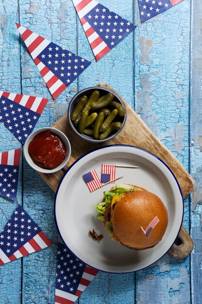 Top view delicious burger with flags