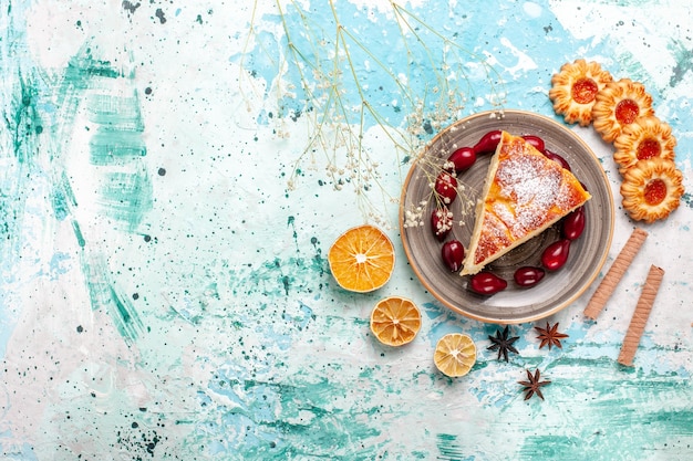 Top view delicious cake slice with cookies on a blue wall cake bake pie biscuit sweet