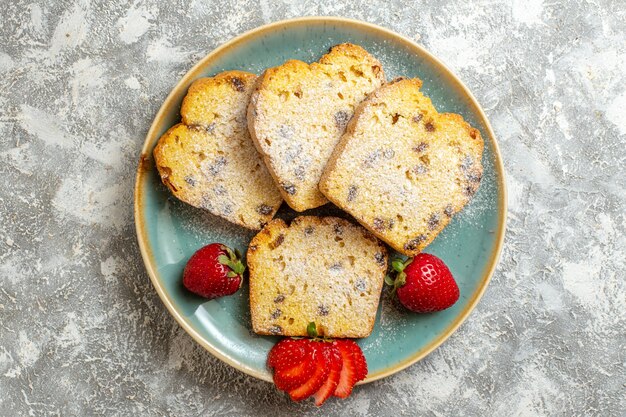 Top view delicious cake slices with fruits on light surface fruit cake pie sweet