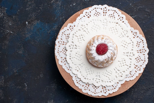 Top view delicious cake with cream and red raspberry on the dark desk cake fruit biscuit 