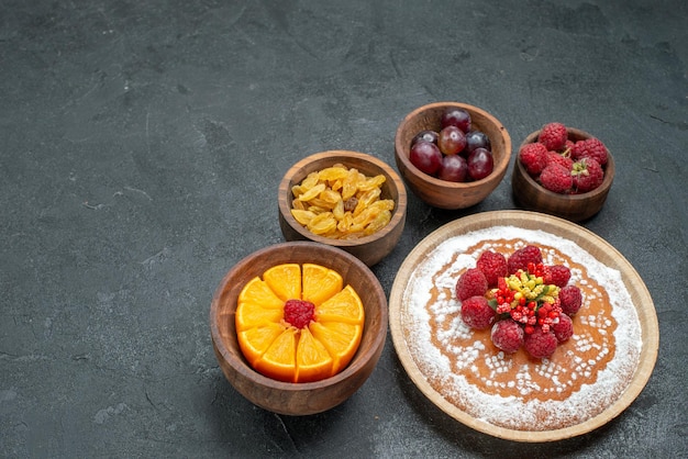 Top view delicious cake with raspberries and fruits on the grey background cake pie fruit berry sweet cookie