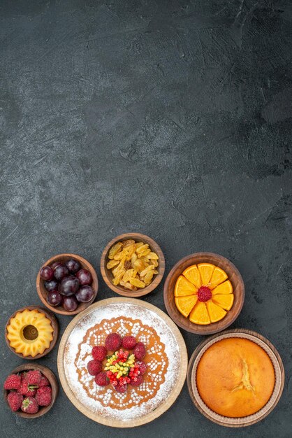 Top view delicious cake with raspberries and fruits on grey background sweet cake pie fruit berry cookies