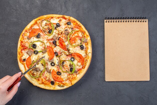 Top view delicious cheese pizza with olives pepper and tomatoes on dark surface