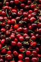 Free photo top view delicious cherries arrangement