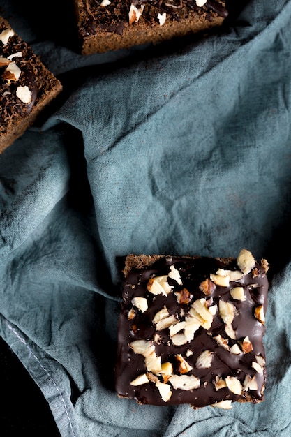 Free photo top view of delicious chocolate cake with almonds