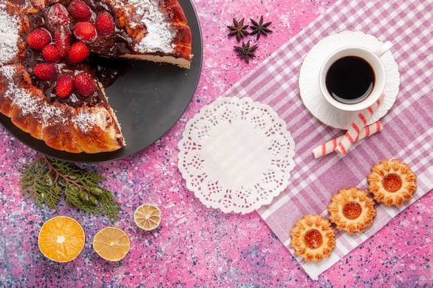 Top view delicious chocolate cake with cookies and cup of tea on pink background biscuit sweet sugar dessert cake bake pie