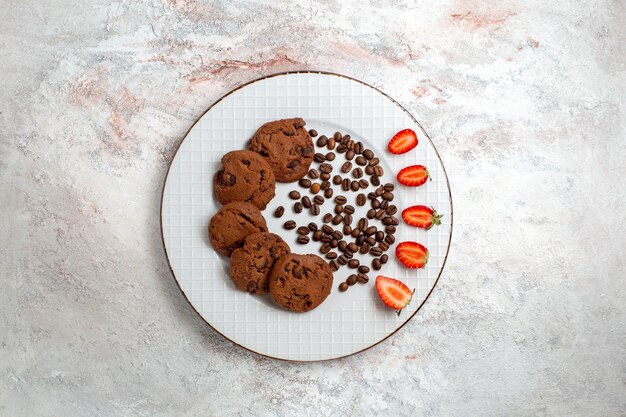 Top view delicious chocolate cookies with chocolate chips on white background biscuit sugar sweet bake cake cookies