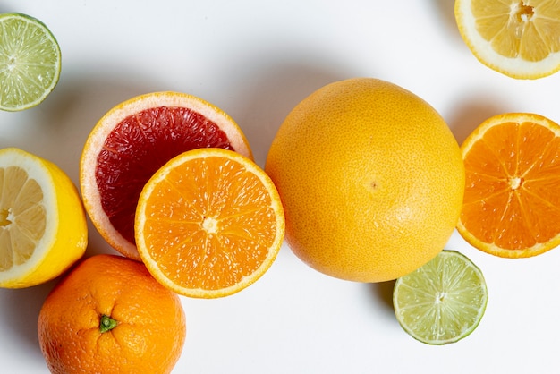 Top view delicious citrus on white background