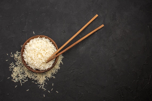 Top view delicious cooked rice tasty eastern meal on dark space