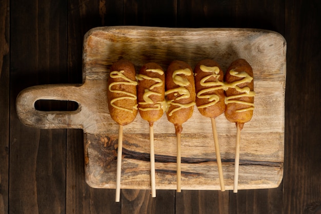 Free photo top view on delicious corn dog