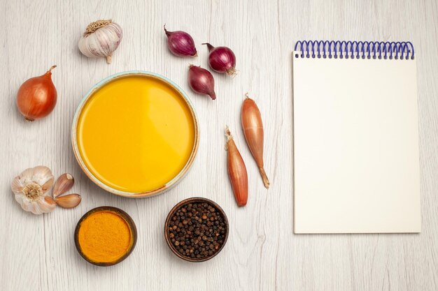 Top view delicious cream soup with vegetables on the white desk soup sauce cream dinner dish meal