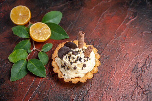 Top view delicious creamy cake on dark table cake sweet dessert