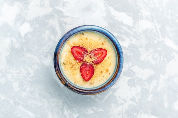 Top view delicious creamy dessert with fresh strawberries on light-white background dessert ice-cream sweet fruit taste