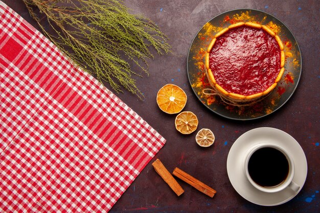 Top view delicious dessert cake with cup of coffee on dark background biscuit sugar sweet cake dessert cookie