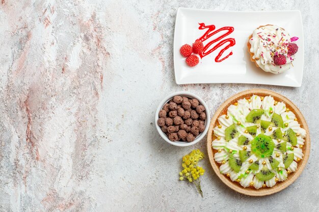 Top view delicious dessert with kiwis on white background dessert biscuit sweet