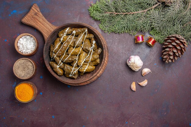 Top view delicious dolma meat dish with different seasonings on dark background meat dinner dish food calorie color