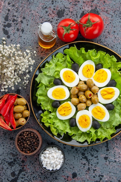 top view delicious egg salad with tomatoes and olives on light background