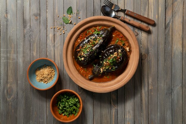 Top view delicious eggplants dish still life