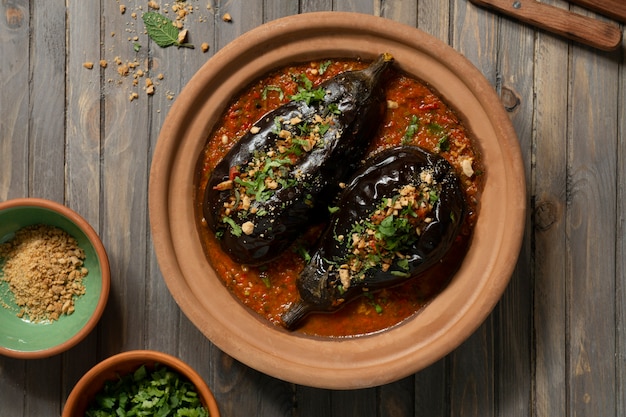 Top view delicious eggplants dish still life