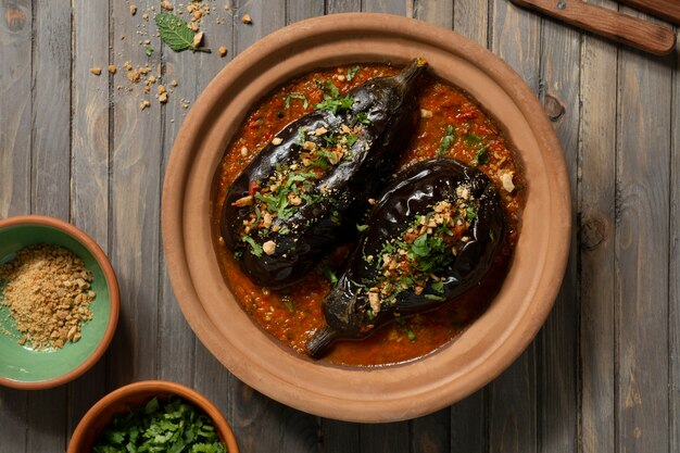 Top view delicious eggplants dish still life