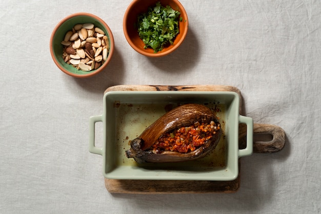 Top view delicious eggplants dish still life