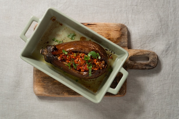 Top view delicious eggplants dish still life