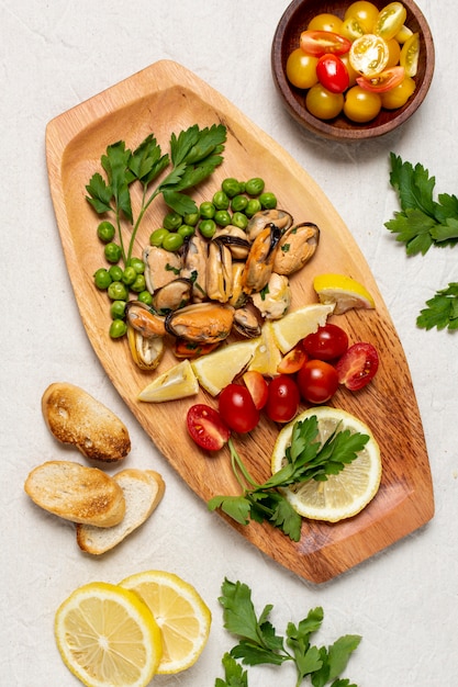 Top view delicious food on a wooden board