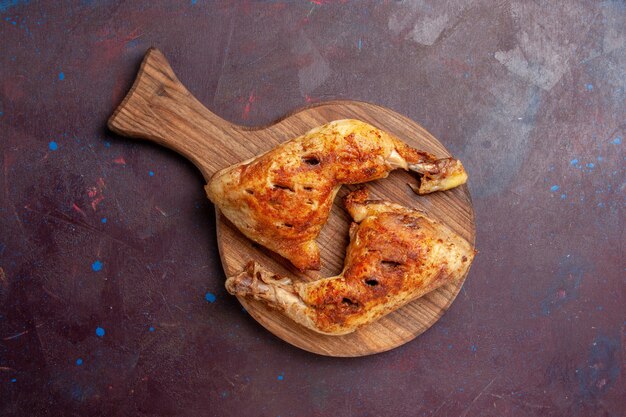 Top view delicious fried chicken cooked meat slices on dark space