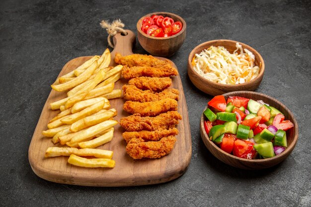 Top view of delicious fried chicken with french fries