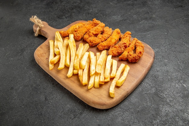 Top view of delicious fried chicken with french fries