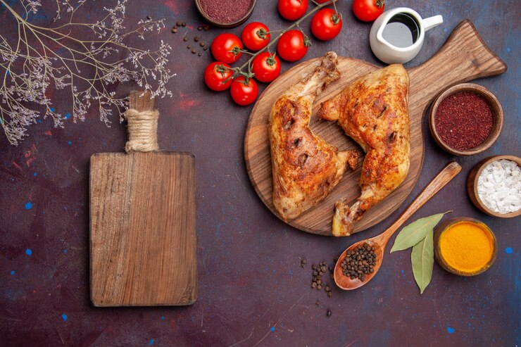 Free Photo top view delicious fried chicken with seasonings and vegetables on dark purple space