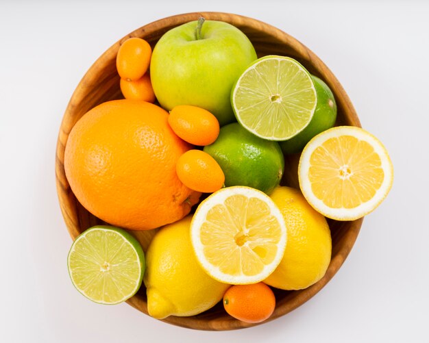 Top view delicious fruits in bowl