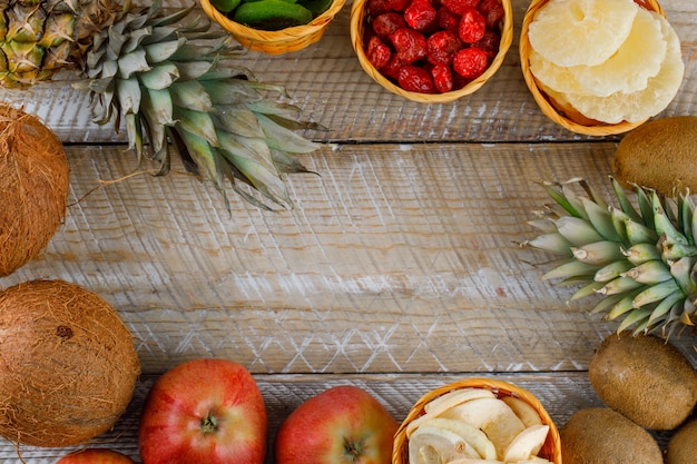 Top view of delicious fruits on a wooden surface