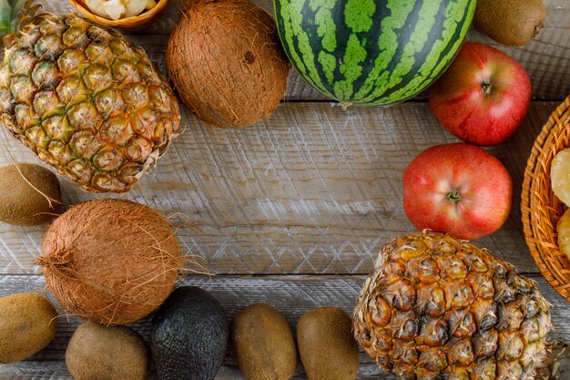 Top view of delicious fruits on a wooden surface