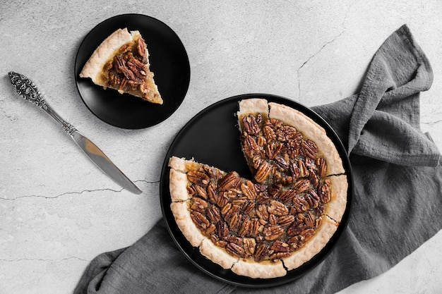 Top view delicious handmade pecan pie on a plate