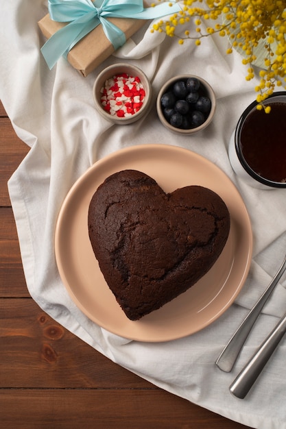 Free photo top view delicious heart shape cake