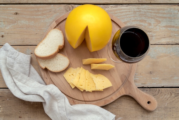 Top view delicious homemade cheese with bread