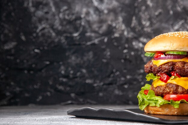 Top view of delicious homemade sandwich on the left side on gray ice distressed isolated surface