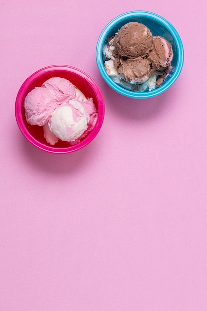 Top view delicious ice cream in bowls with copy space