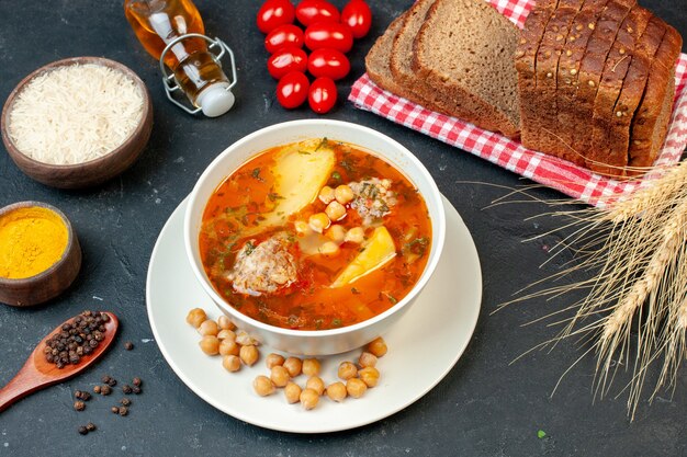 Top view delicious meat soup consists of potatoes and meat on dark background