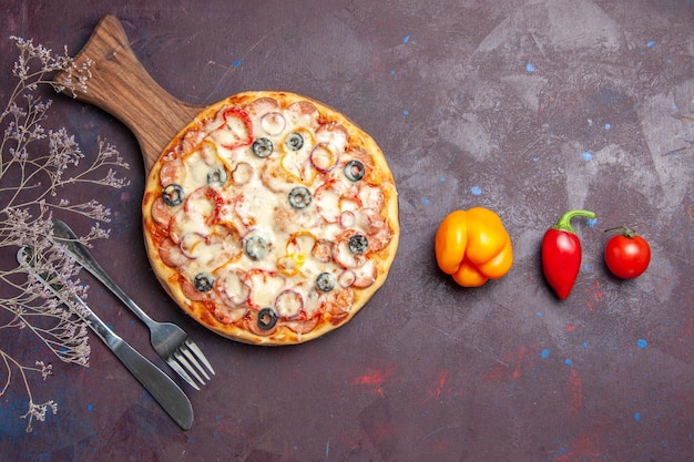 Top view delicious mushroom pizza with cheese olives and tomatoes on the dark surface pizza meal dough food italian