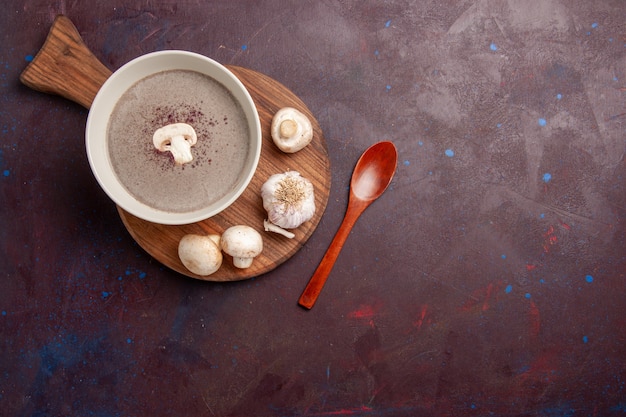 Top view delicious mushroom soup with fresh mushrooms on dark space