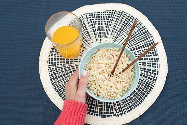 Top view delicious noodles in bowl