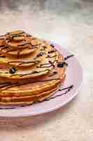 Free photo top view on delicious pancakes pile