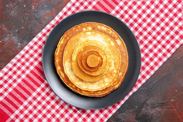 Free photo top view on delicious pancakes pile