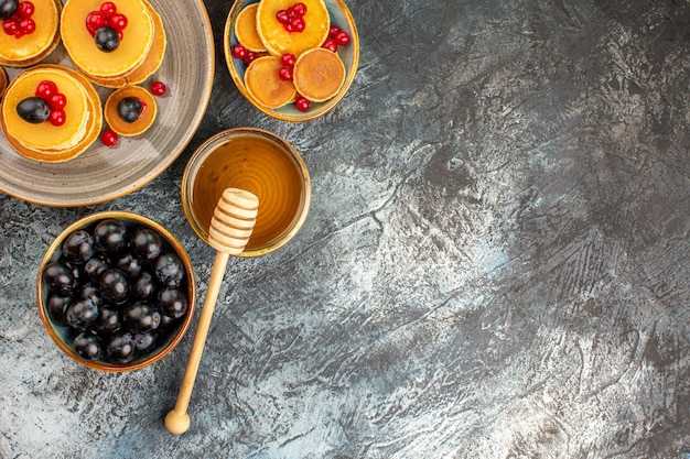 Top view on delicious pancakes with various ingredients