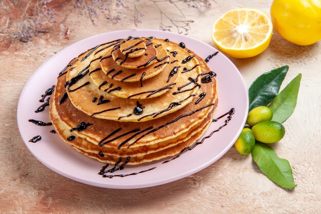 Top view on delicious pancakes with various ingredients